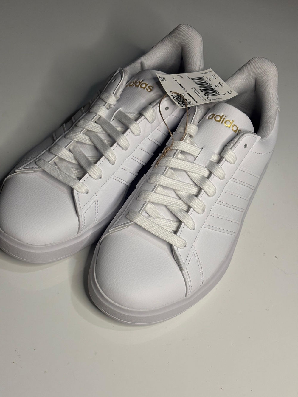 adidas White Leather Sneakers with Gold Branding